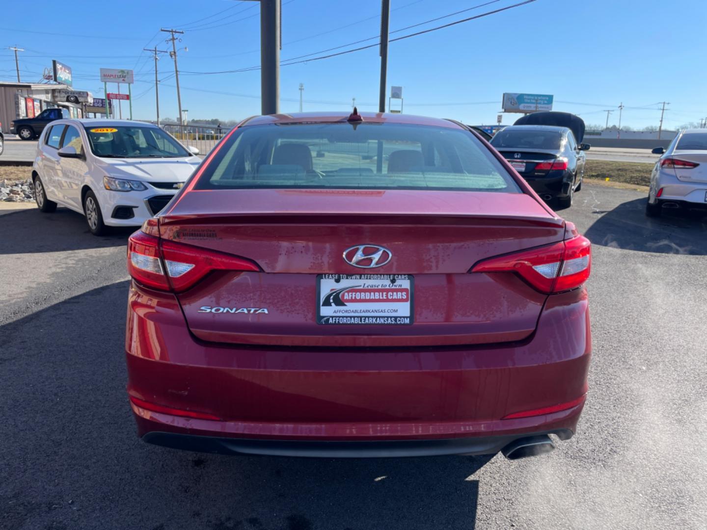 2016 Maroon Hyundai Sonata (5NPE24AF6GH) with an 4-Cyl, 2.4 Liter engine, Auto, 6-Spd w/Shiftronic and Drive Mode Select transmission, located at 8008 Warden Rd, Sherwood, AR, 72120, (501) 801-6100, 34.830078, -92.186684 - Photo#6